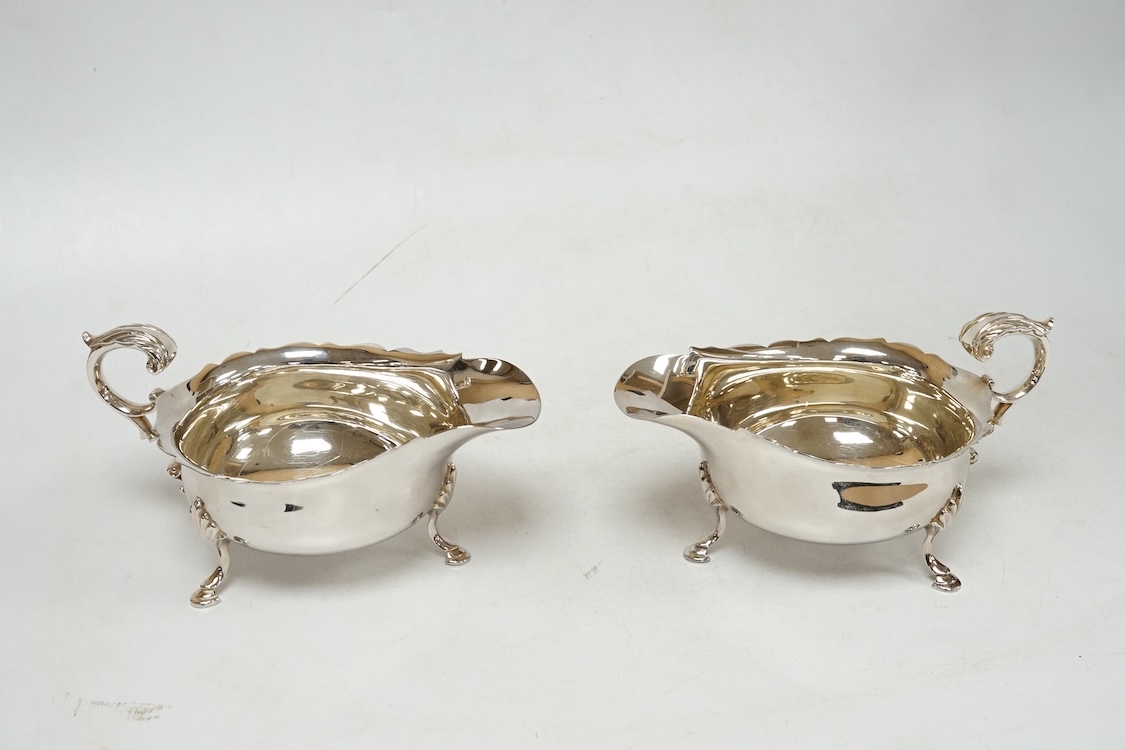 A pair of modern silver sauceboats, with flying scroll handles, C.J. Vander Ltd, Sheffield, 1989, length 14.9cm, 9.5oz.